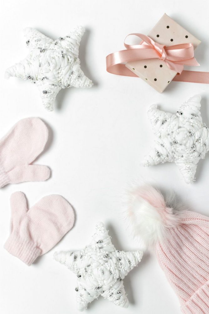 Collection of baby mittens, stars and hats