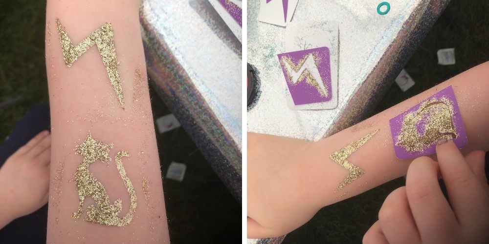 Glitter tattoos of a lightning bolt and cat