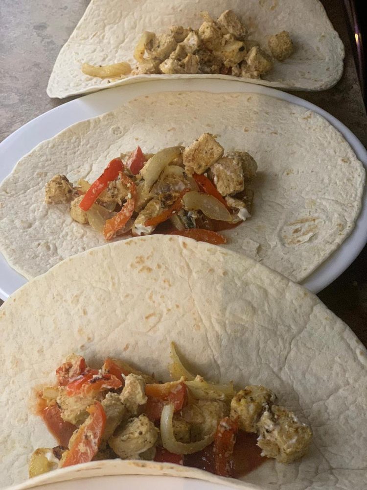 Tortilla wraps stuffed with chicken mix