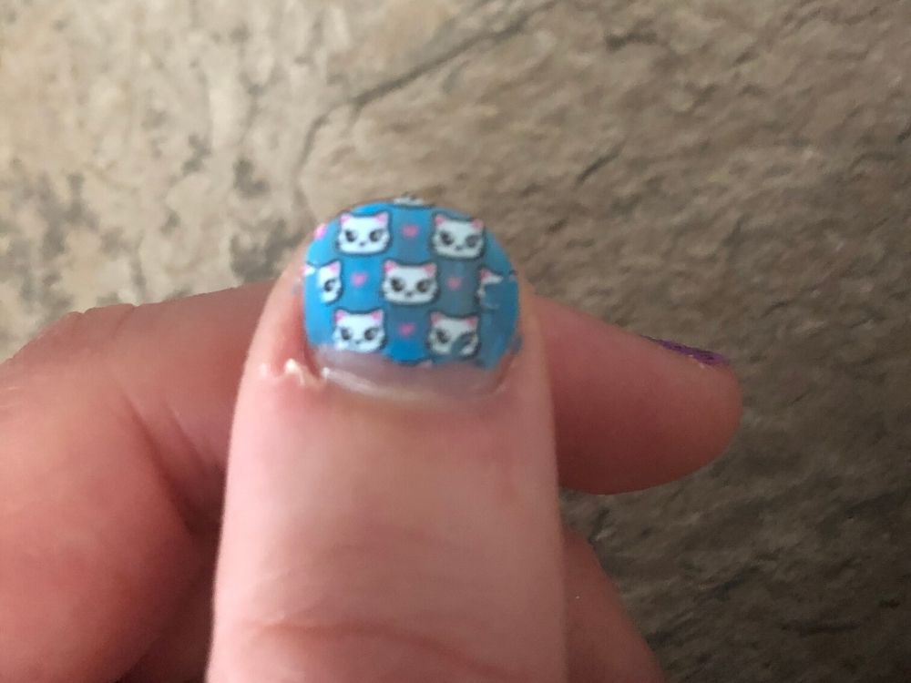 Cat stamp on blue nail