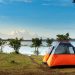 Camping tent next to water